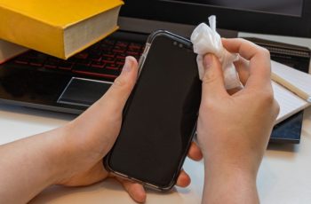 Woman-Cleaning-Phone-With-Wipes