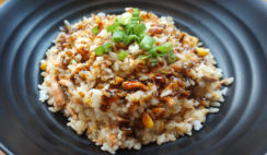 Cooked-Brown-Rice-In-Black-Ceramic-Plate