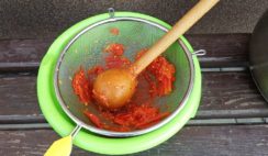 Making-Tomato-Puree-Using-Sieve-And-Spoon